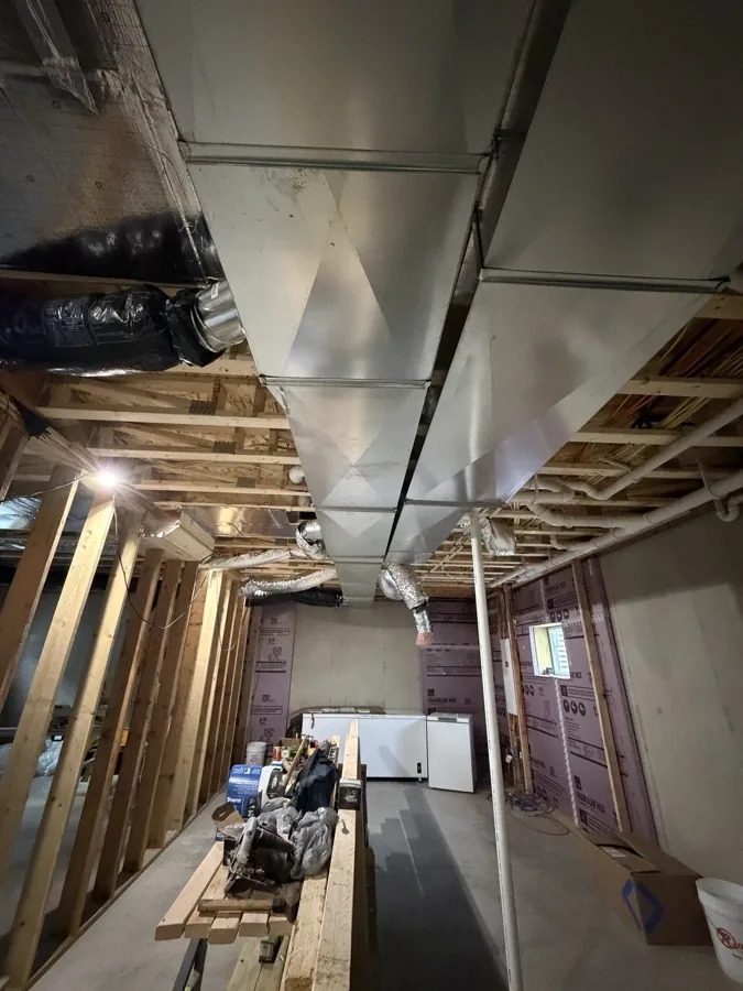 Exposed ductwork inside a building under construction