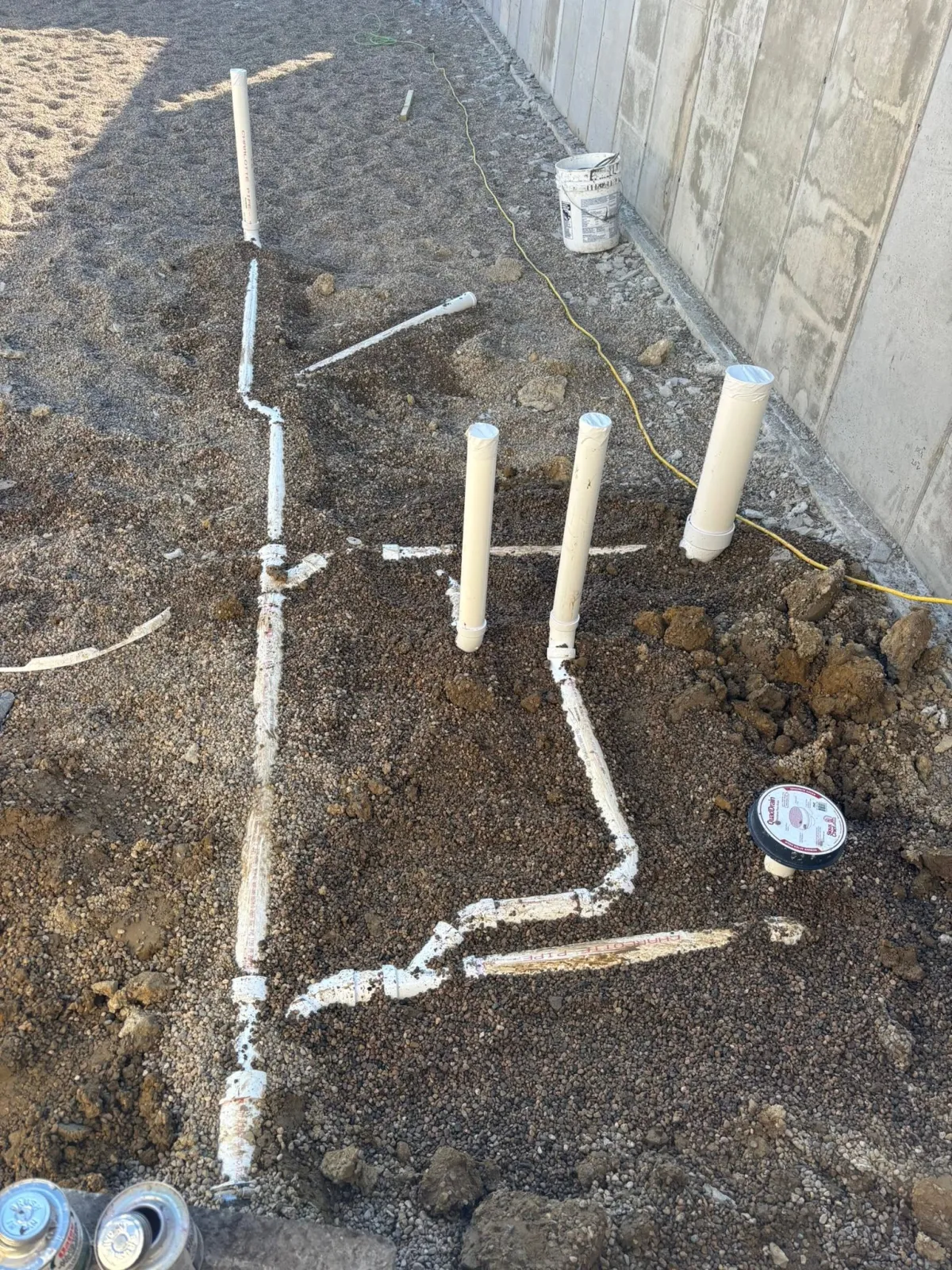Drain and waste pipe layout before the concrete floor is poured