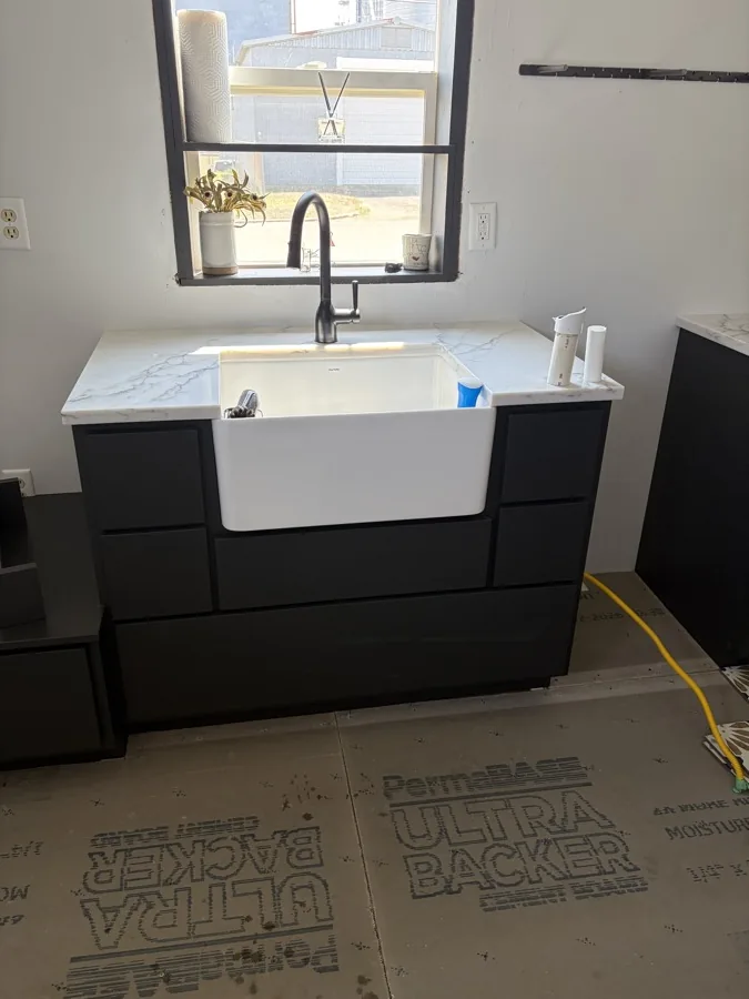 Bathroom remodel with a double vanity and installed faucets